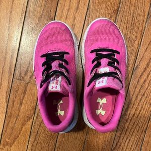 Pink child under armour sneakers